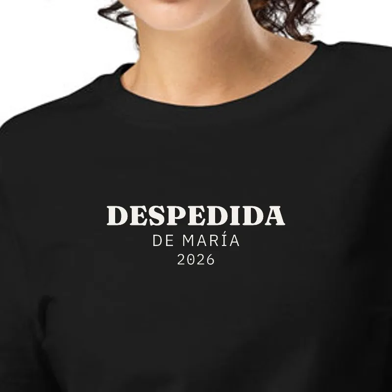 Dona amb samarreta negra, enquadrament al segell: COMIAT · DE LA MARIA